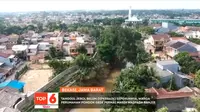 Tanggul Jebol Masih Dalam Perbaikan, Warga Perumahan Pondok Gede Permai Waspada Banjir . sumberfoto: SCTV