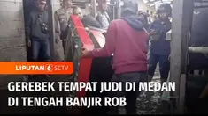 Polres Pelabuhan Belawan menggerebek sebuah rumah yang dijadikan tempat praktik judi di kawasan padat penduduk di Kota Medan, Sumatera Utara. Penggerebekan dilakukan meski pada saat yang sama banjir air pasang atau rob melanda.