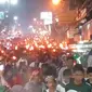 Meriahnya pawai obor malam tahun baru Islam 1 Muharam 1444 Hijriah di Puncak Bogor, Jumat (29/7/2022). (Liputan6.com/Achmad Sudarno)