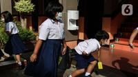 Sejumlah siswa terlihat saat pelaksanaan Pembelajaran Tatap Muka (PTM) di SD Pangudi Luhur Jakarta, Rabu (25/5/2022). Pemerintah pusat menerapkan Pemberlakuan Pembatasan Kegiatan Masyarakat (PPKM) level 1 untuk wilayah aglomerasi Jakarta, Bogor, Depok, Tangerang, dan Bekasi (Jabodetabek) selama dua pekan, terhitung sejak 24 Mei. (Liputan6.com/Johan Tallo)