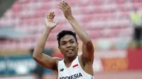 Sprinter Indonesia, Lalu Muhammad Zohri merayakan kemenangan pada final 100 meter Putra IAAF World Junior Championships 2018 di Tampere, Finlandia, (11/7/2018). (AFP/Lehtikuva/Kalle Parkkinen/Finland OUT)