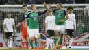 Pemain Irlandia Utara, Josh Magennis dan George Saville melakukan selebrasi usai cetak gol ke gawang Jerman pada laga Kualifikasi Piala Dunia 2018 di Stadion Windsor Park, Kamis (5/10/2017). Jerman menang 3-1 atas Irlandia Utara. (AP/Peter Morrison)