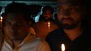 <p>Anggota Kongres Pemuda India ikut serta dalam pawai menyalakan lilin di New Delhi, India, Senin (31/10/2022). Buntut dari ambruknya jembatan tersebut 9 orang ditangkap karena bertanggung jawab atas pemeliharaan jembatan di atas sungai Machchhu tersebut. (AFP/Sajjad HUSSAIN)</p>