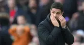 Pelatih Arsenal Mikel Arteta tidak dapat mengatasi kekecewaan setelah putra angkatnya jatuh dari West Ham United 0-1 di London Derby di Stadion Emirates pada hari Sabtu (22/22/2025) di malam hari. (Foto AP/Kirsty Wigglesworth)