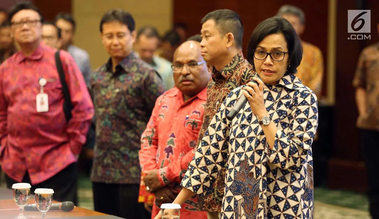 Menkeu Sri Mulyani saat acara penandatangan perjanjian Pengambilan Saham Divestasi PT Freeport Indonesia, Jakarta, (12/2). Pemerintah Daerah Papua resmi dapatkan 10% saham holding BUMN Tambang yang dipimpin PT Inalum (Persero). (Liputan6.com/Johan Tallo)