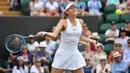 Petenis Rusia Maria Sharapova berusaha mengembalikan bola pukulan petenis Prancis, Pauline Parmentier dalam pertandingan tunggal putri di hari kedua Wimbledon Tennis Championships di London, Inggris (2/7/2019). Sharapova takluk atas Parmentier 6-4, (4) 6-7, 0-5. (AFP Photo/Ben Stansall)