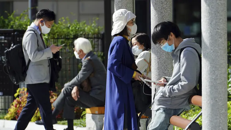 FOTO: Tokyo Konfirmasi Lebih dari 700 Kasus Baru COVID-19