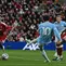 Gelandang asal Prancis milik Manchester City, Rayan Cherki (nomor punggung 10), melepaskan tembakan yang mencetak gol ketiga timnya dalam pertandingan Liga Inggris antara Liverpool dan Manchester City di Anfield, Liverpool, Inggris barat laut, pada 11 Oktober 2026. (Paul ELLIS/AFP)