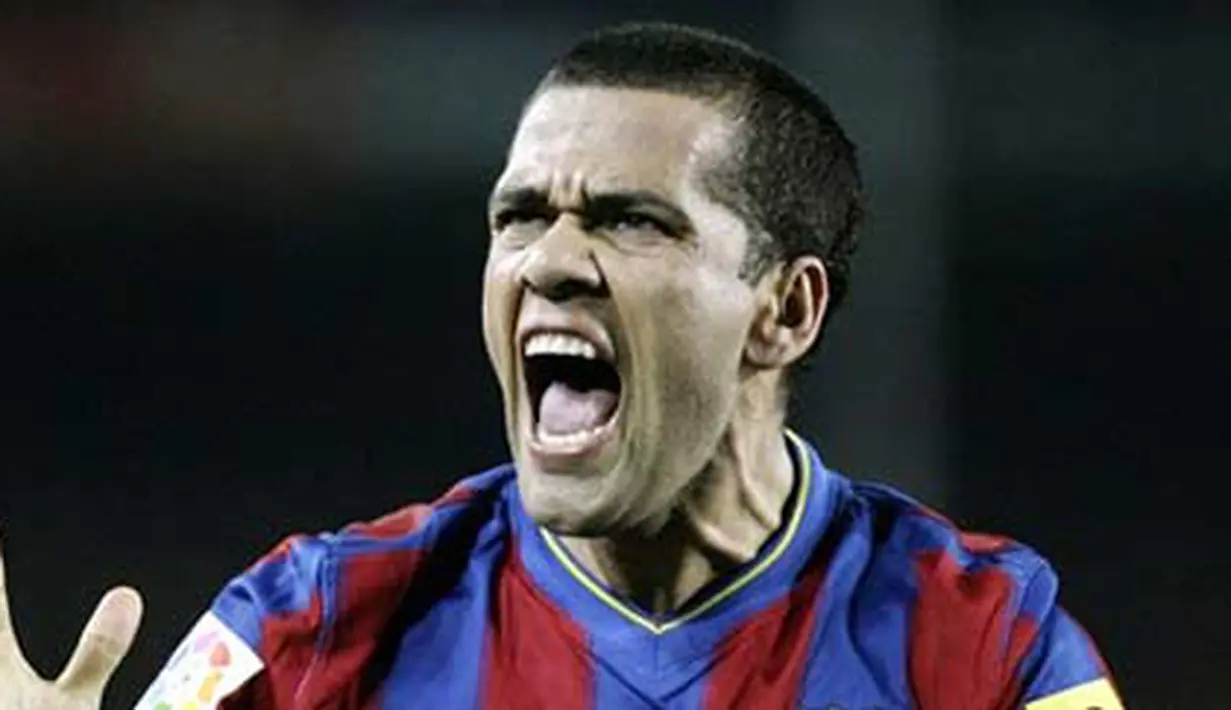 Kegembiraan bek Barcelona, Daniel Alves seusai gol Lionel Messi ke gawang Malaga dalam lanjutan La Liga di Camp Nou Stadium, 27 Februari 2010 AFP PHOTO / JOSEP LAGO 