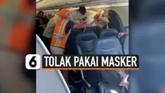 PENUMPANG PESAWAT BUAT KERIBUTAN KARENA TOLAK PAKAI MASKER