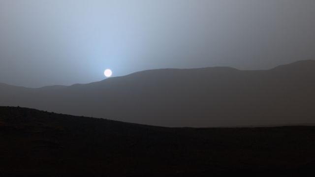 The sun sinks below the horizon in this stunning panoramic view captured by NASA's Spirit Mars rover in 2005 (NASA/JPL/Texas A&M/Cornell )