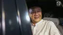 Mantan Kepala BPPN, Syafruddin Arsyad Temenggung tersenyum saat meninggalkan rumah tahanan KPK, Jakarta, Selasa (7/9/2019). Sebelumnya, Mahkamah Agung mengabulkan permohonan kasasi yang diajukan Syafruddin Arsyad Temenggung dalam kasus korupsi SKL BLBI. (Liputan6.com/Helmi Fithriansyah)
