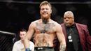 Conor Mcgregor - Forbes menempatkan McGregor sebagai atlet berpenghasilan tertinggi pada tahun 2021. Atlet UFC ini menghasilkan 8,6 juta dollar atau setara Rp121,1 miliar setiap menitnya. (AFP/Harry How)