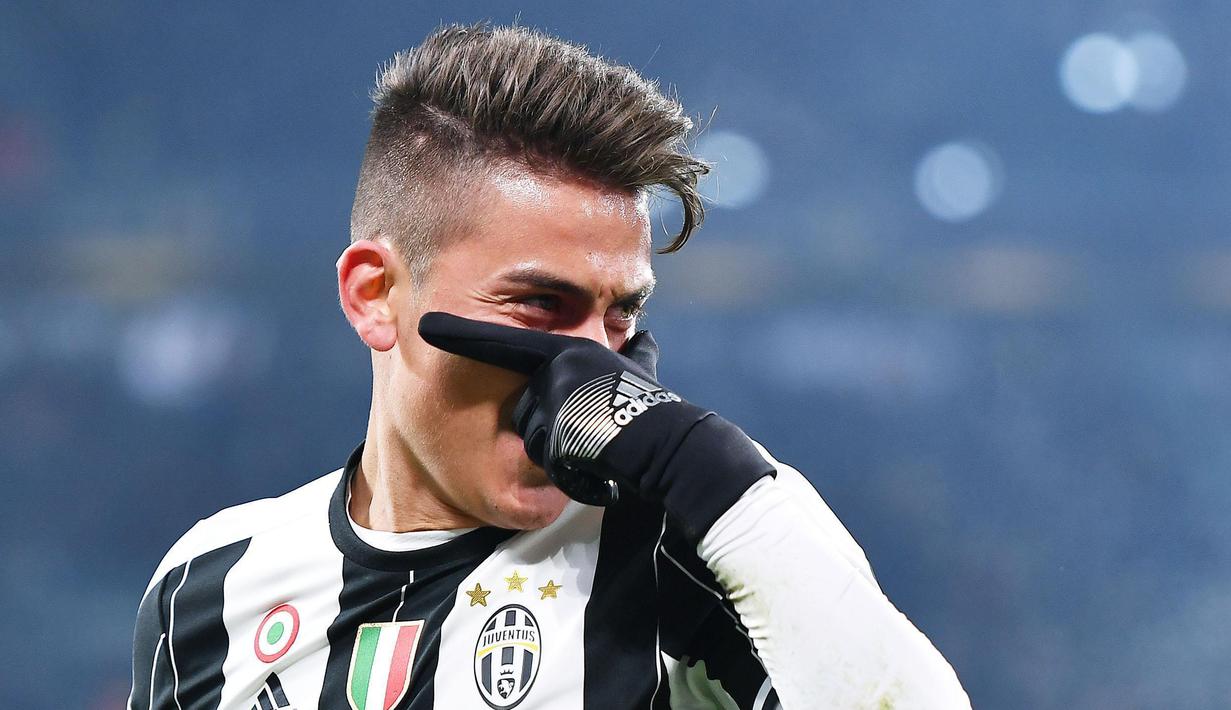 Gaya pemain Juventus, Paulo Dybala usai mencetak gol ke gawang Atalanta pada laga semifinal Coppa Italia di Juventus Stadium, Turin (11/1/2017). Juventus menang 3-2. (Alessandro Di Marco/ANSA via AP)