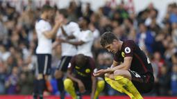 Manchester City akhirnya menderita kekalahan perdana musim ini usai dipermalukan Tottenham 2-0. Meski kalah, City masih tetap berada di puncak klasemen dengan poin 18, hasil dari enam kali kemenangan. (AFP/Ikimages)