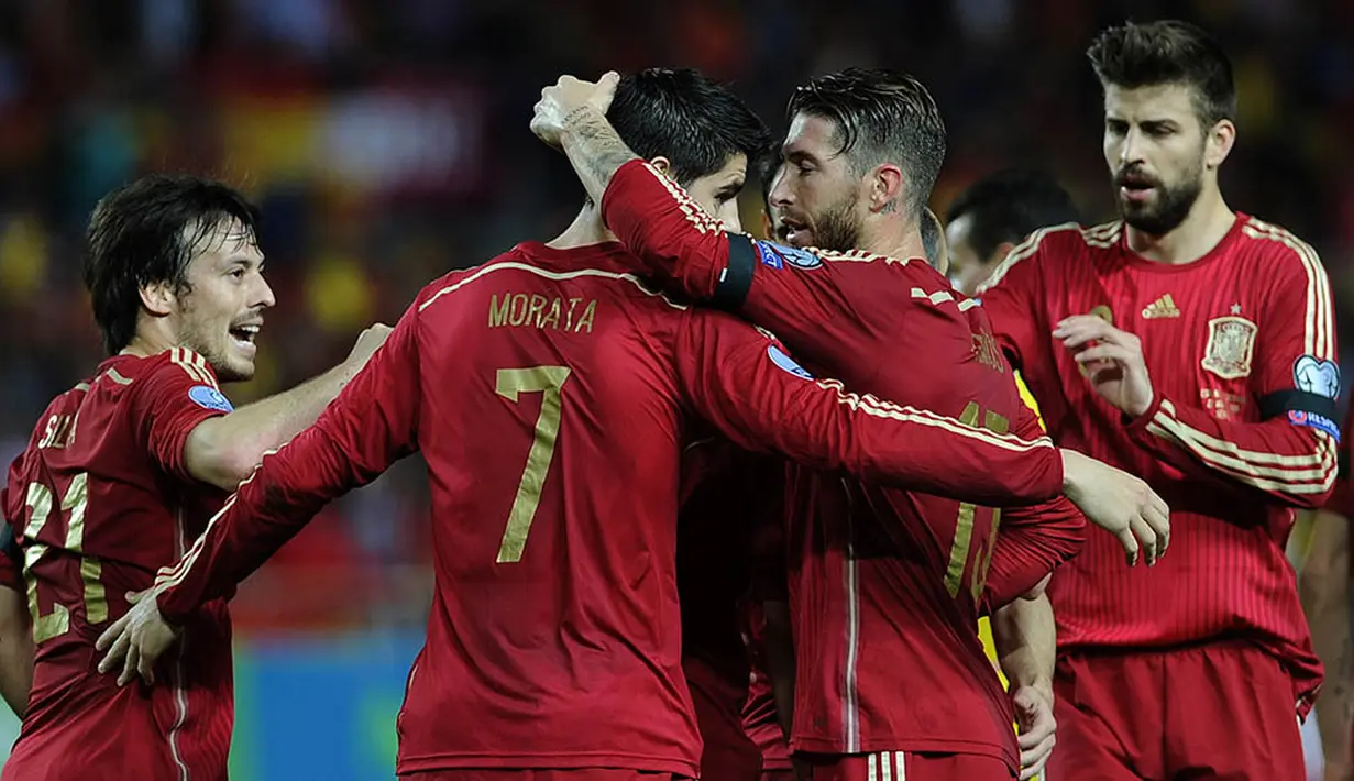 5. Tahun 2015 sepertinya menjadi momen baik bagi karier Alvaro Morata. Selain prestasi bersama Juve, dirinya juga sukses menembus timnas Spanyol dan berhasil mencetak gol perdananya bagi La Furia Roja. (AFP/Cristina Quicler)