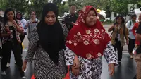Siti Aisyah dan keluarga tiba untuk menemui Presiden Joko Widodo di Istana Merdeka, Jakarta, Selasa (12/3). Siti dibebaskan dari dakwaan hukum kasus pembunuhan Kim Jong Nam di Pengadilan Tinggi Shah Alam, Kuala Lumpur. (Liputan6.com/Angga Yuniar)