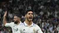 Gelandang Real Madrid, Marco Asensio merayakan setelah mencetak gol ketiga timnya ke gawang Celtic selama pertandingan Grup F Liga Champions di stadion Santiago Bernabeu di Madrid, Spanyol, Kamis (3/11/2022). El Real melaju bersama RB Leipzig yang mengunci posisi dua usai menang telak 4-0 atas Shakhtar Donetsk. (AP Photo/Manu Fernandez)