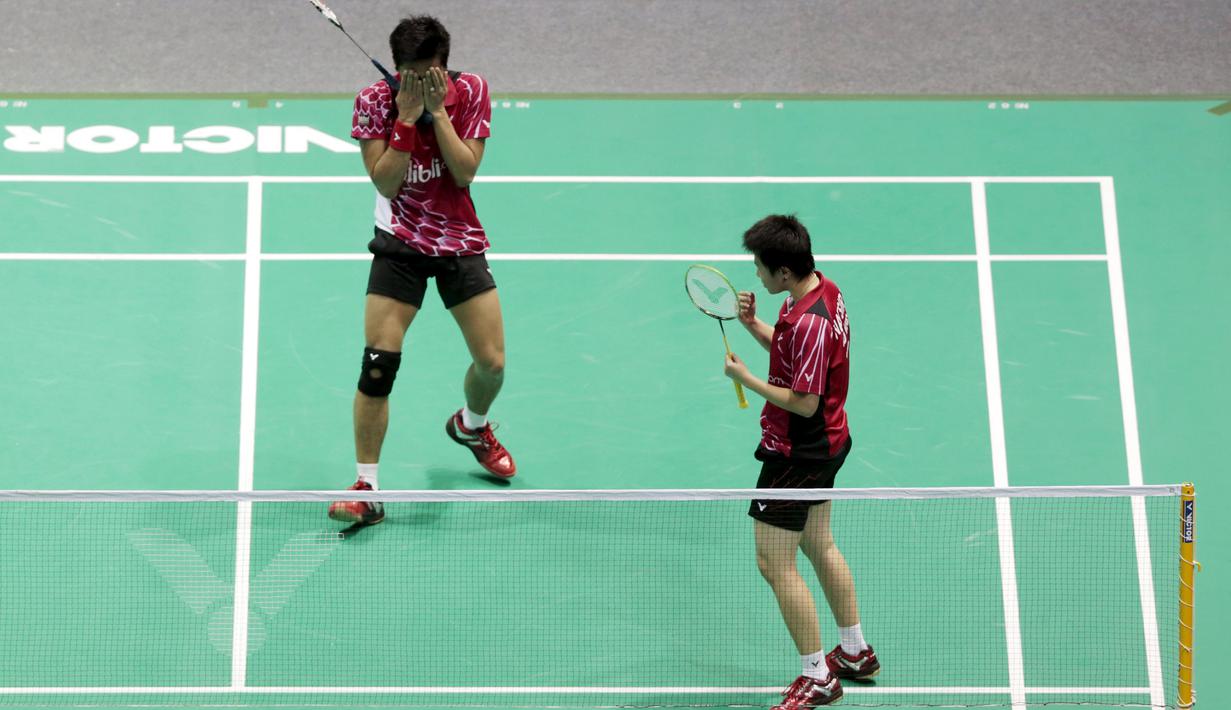 Ekspresi bahagia Tontowi/Liliyana usai juara Asia Championship 2015 di di Wuhan Sports Center Gymnasium, Minggu (26/4/2015).  (Reuters/China Daily)