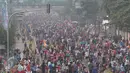 Suasana Car Free Day di kawasan Bundaran HI, Jakarta, Minggu (27/12/2015). Kemeriahan libur akhir tahun dimanfaatkan warga untuk menikmati lengangnya Jakarta. (Liputan6.com/Angga Yuniar)