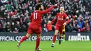 Gelandang Liverpool, Mohamed Salah, merayakan gol yang dicetaknnya ke gawang Watford pada laga Premier League di Stadion Anfield, Liverpool, Sabtu (14/12). Liverpool menang 2-0 atas Watford. (AFP/Paul Ellis)
