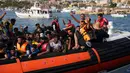 Para imigran tiba di pelabuhan pulau Lampedusa, Italia, pada 18 September 2023. (Zakaria ABDELKAFI / AFP)