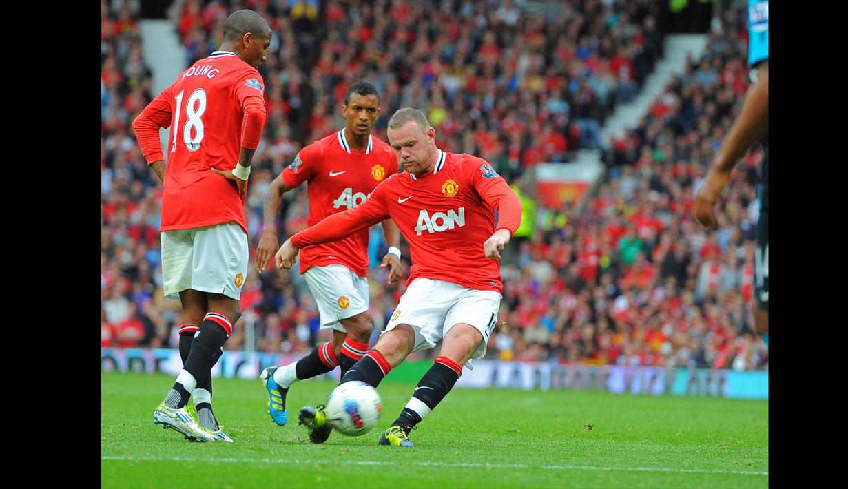 Arsenal merupakan salah satu klub besar yang menjadi keberingasan Wayne Rooney. 15 gol ia cetak ke gawang Arsenal dalam 35 penampilan di semua ajang. Salah satu partai terbaik Rooney melawan Arsenal terjadi di Premier League 2011/2012. Saat itu Rooney mencetak hattrick yang turut membawa United menang telak 8-2. (AFP/Andrew Yates)