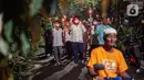 Warga mengikuti pawai obor menyambut Ramadan di kawasan Matraman Dalam, Jakarta, Minggu (27/3/2022). Pawai obor tersebut juga digelar untuk meningkatkan silaturahmi dan ukhuwah sesama umat Muslim serta menyemarakkan syiar Islam di Ibu Kota. (Liputan6.com/Faizal Fanani)