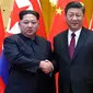 Kim Jong Un bertemu Presiden China Xi Jinping. (Ju Peng/Xinhua via AP)