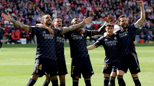 Penyerang Real Madrid, Joselu, ketika mencetak gol ke gawang Rayo Vallecano di La Liga 2023/2024.
