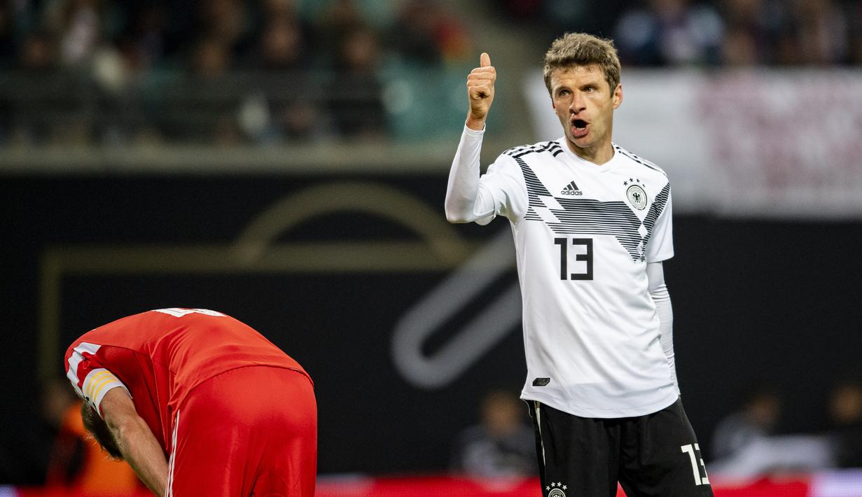 Penampilan impresif ditunjukan pemain senior Jerman, Thomas Muller pada laga persahabatan kontra Rusia di Stadion Red Bull Arena, Leipzig. Timnas Jerman menang 3-0. (AFP/Odd Andersen)