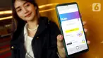 Model menunjukkan aplikasi produk pinjaman digital yang dapat diakses melalui aplikasi myIM3, UCan di Jakarta, Rabu (19/1/2022). UCan menawarkan dua fitur utama yaitu Cash Withdrawal dan fitur Instalment. (Liputan6.com/HO/Rizki)
