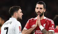 Pemain Liverpool, Dominik Szoboszlai melakukan selebrasi seusai membobol gawang Barnsley pada lanjutan Piala FA 2025/2026 di Anfield, Selasa (13/1/2026) dini hari WIB. (PETER POWELL / AFP)