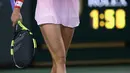 Eugenie Bouchard yang pernah mendapat gelar “WTA Newcomer of the Year 2013″ ini tak hanya dikenal sebagai bibit unggul di cabang olahraga tenis. Tapi tentu saja kemolekannya banyak mengundang decak kagum. (Julian Finney/Getty Images/AFP)