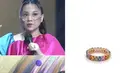 Dengan perhiasan cincin 'Oval Rainbow Eternity Ring' dari brand Clemence Ellery, Nagita Slavina tampil di sebuah acara TV, memadukannya dengan outfit senada. Di akhir tahun 2021, harga cincin ini mencapai Rp33.000.000.