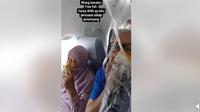 Rekaman video viral yang menunjukkan penumpang pesawat Malaysia Airlines terpaksa menggunakan masker oksigen di tengah penerbangan. (dok. FB Abdul Jalil)