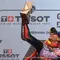 Pembalap Prima Pramac Ducati Racing, Jorge Martin mengangkat trofi saat merayakan kemenangannya di atas podium setelah memenangi balapan MotoGP Portugal di Sirkuit Internasional Algarve, Portimao, 24 Maret 2024. (PATRICIA DE MELO MOREIRA/AFP)