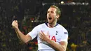 Selebrasi gol Harry Kane pada leg kedua, babak 16 besar Liga Champions yang berlangsung di Stadion Signal Iduna Park, Dortmund, Rabu (6/3). Tottenham Hotspur menang 1-0 atas Dortmund. (AFP/Bernd Thissen)