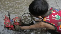 Sedikitnya 14 orang tewas di Filipina utara setelah badai tropis menghantam wilayah tersebut dengan angin kencang dan hujan lebat yang menyebabkan banyak laporan banjir dan tanah longsor. (AP Photo/Aaron Favila)