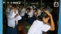 Untuk memitigasi risiko gempa bumi megathrust segmen Selat Sunda, warga Jakarta mulai dipersiapkan melalui serangkaian pelatihan simulasi bencana. (Liputan6.com/Herman Zakharia)