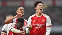 Di balik kehebatan Arsenal asuhan Mikel Arteta dalam beberapa musim terakhir di Liga Inggris, terdapat sosok pesepak bola asal Jepang, Takehiro Tomiyasu yang manjadi andalan di lini belakang The Gunners. Jauh sebelum memutuskan hijrah ke Eropa, pesepak bola kelahiran Fukuoka 25 tahun lalu ini merupakan alumnus J.League bersama Avispa Fukuoka. (AFP/Glyn Kirk)