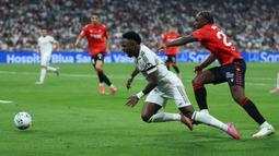 Pihak Vinicius Jr telah menyodorkan kontrak baru sebanyak dua kali pada akhir Desember tahun lalu dan awal Mei ini. Sayangnya, perundingan tersebut tak menemui titik terang. (AFP/Thomas Coex)