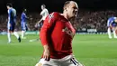 Selebrasi striker Manchester United Wayne Rooney seusai mencetak gol ke gawang Chelsea pada leg pertama perempat final Liga Champions di Stamford Bridge, 6 April 2011. AFP PHOTO/ADRIAN DENNIS
