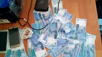 Uang palsu itu dicetak menggunakan printer milik kantor desa di Jeneponto, Sulsel. (Liputan6.com/Eka Hakim)