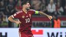 Gelandang Liverpool berusia 23 tahun, Dominik Szoboszlai akan menjalani debut sebagai kapten Timnas Hungaria di turnamen besar pada Euro 2024 setelah menggantikan peran Adam Szalai yang pensiun dari timnas sejak 2022. Bersama Timnas Hungaria, Dominik Szoboszlai yang menjadi kapten termuda di ajang Euro 2024 hingga kini telah mengoleksi 42 caps dengan torehan 12 gol dan 5 assist. (AFP/Attila Kisbenedek)