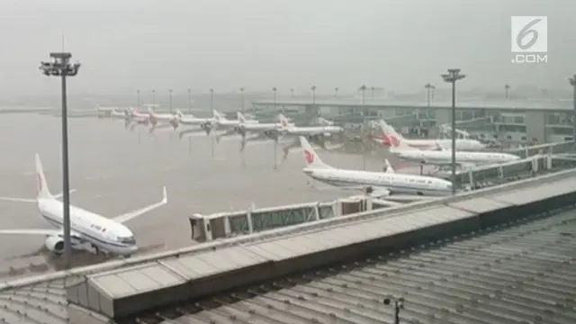 Topan ampil menerpa Beijing dan Tianjin, China. Akibatnya 13 penerbangan dibatalkan dan 20 penerbangan tertunda.