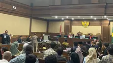 Auditor Badan Pemeriksa Keuangan (BPK) Muhammad Ramadhani mengungkapkan empat tahapan penghitungan kerugian keuangan negara dalam sidang kasus dugaan korupsi pengelolaan kuota haji tambahan periode 2023-2024. (Liputan6.com/Dimas Ramadhan Wicaksana)