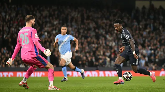 Foto: Dua Gol Vincius Jr untuk Real Madrid Pulangkan Manchester City di Babak 16 Besar Liga Champions