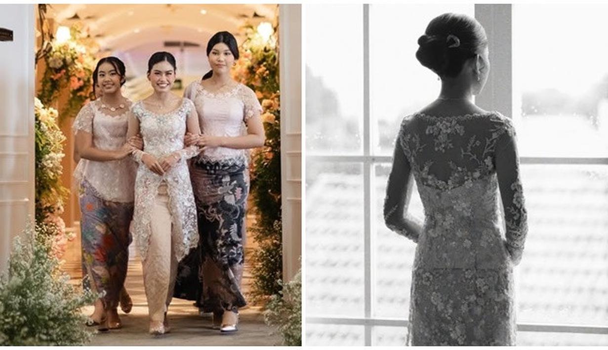 Potret Adjani ketika diantar oleh kedua adiknya bertemu Audi. Segera melepas masa lajangnya, kebahagiaan terpancar jelas di wajah gadis kelahiran 1999 ini. Dari tampak depan terlihat kebaya yang dikenakan oleh Adjani ini model belah depan. Sementara tampak belakang kebaya Adjani memiliki detail backless dengan paduan bustier putih tulang yang makin mempertegas lekuk tubuh. (Liputan6.com/IG/@namiradjani)