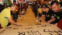 Salah satu peserta pemecahan reko Muri, Kezia (8) mengaku tidak sulit dalam menulis kaligrafi China.